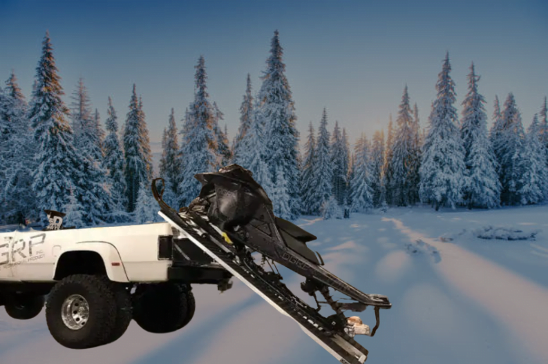 Snowmobile in short bed truck